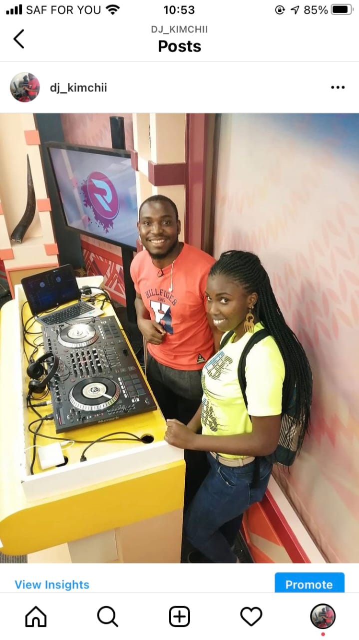 DJ Kimchi behind the decks at an event with a professional DJ setup